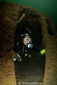 Diver exits cabin of sunken boat at the Welland Scuba Park. by David Gilchrist 